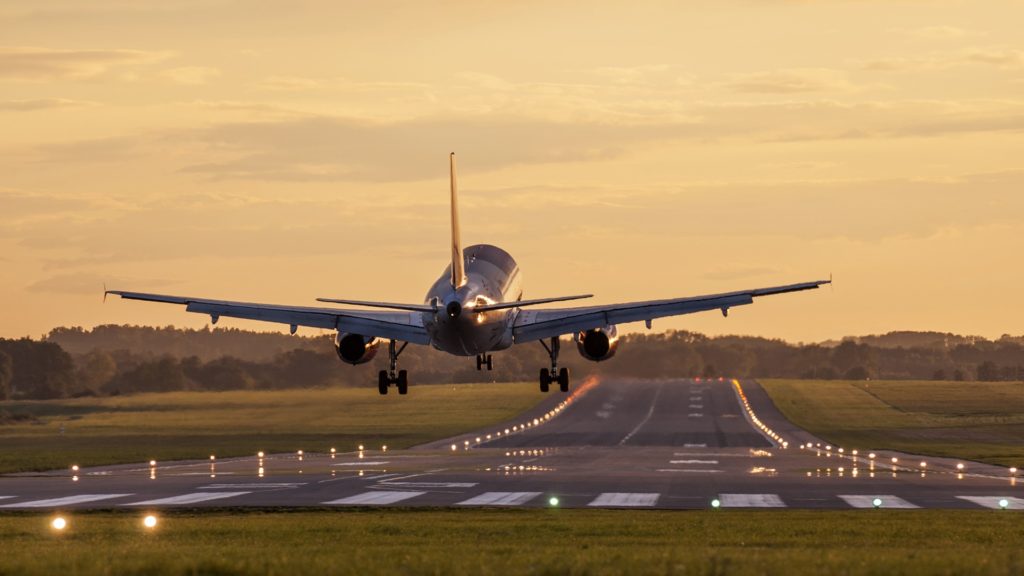 an airplane is taking off from the runway