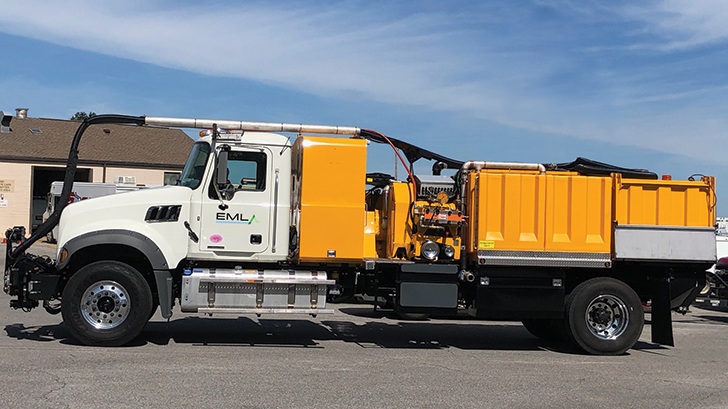 a large yellow truck parked in a parking lot