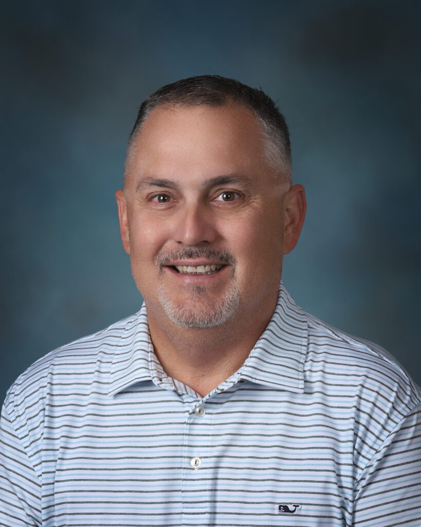 a man in a blue and white striped shirt