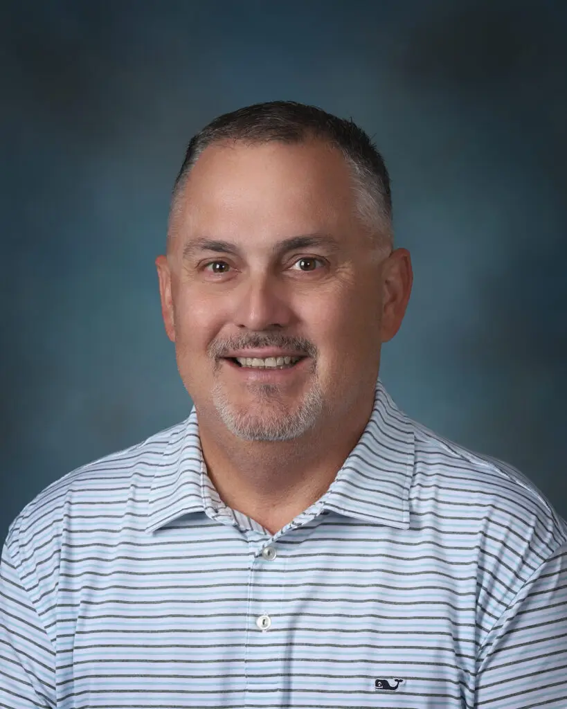 a man in a blue and white striped shirt